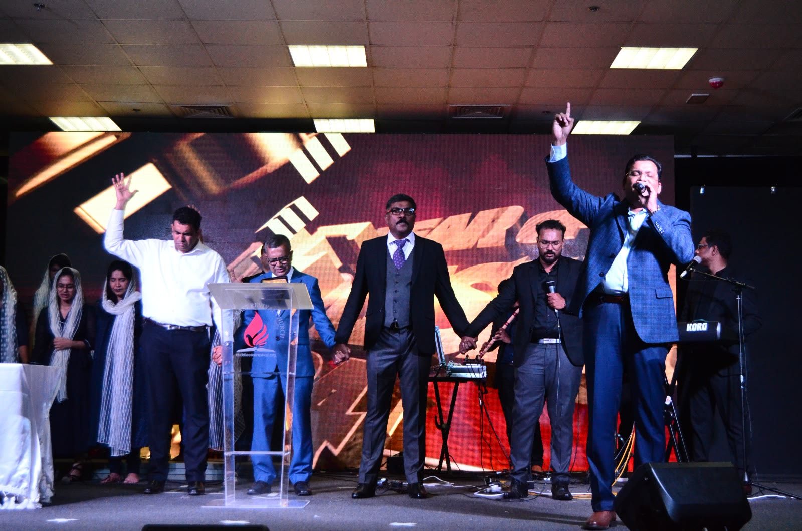 Pastors leading worship on stage at MERC Dubai